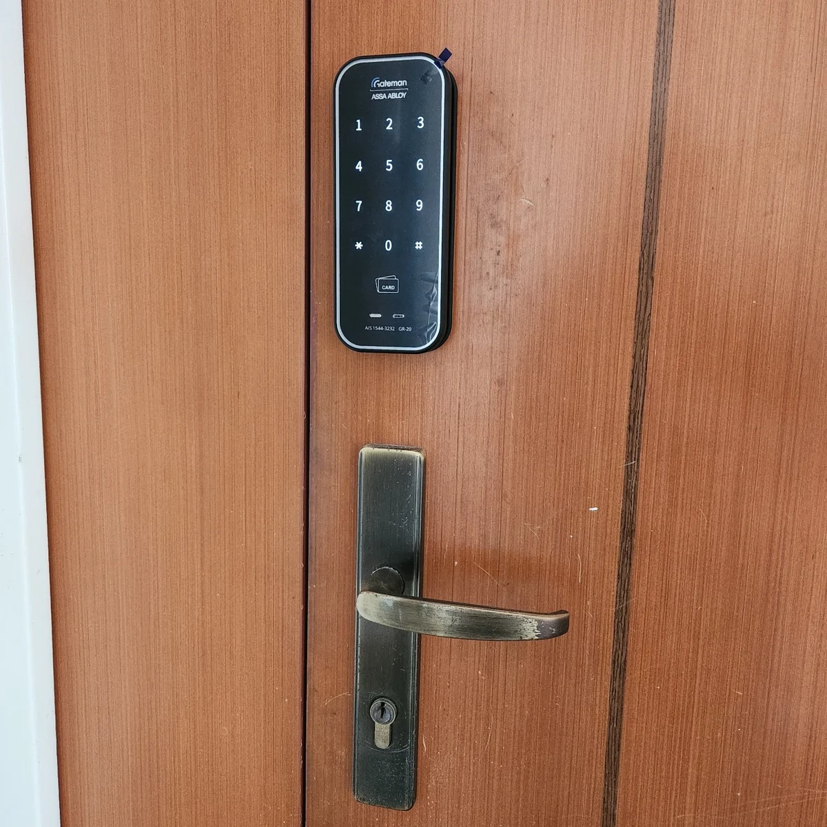 Gateman GR20 Digital Lock fitted above the existing handle on a wooden door