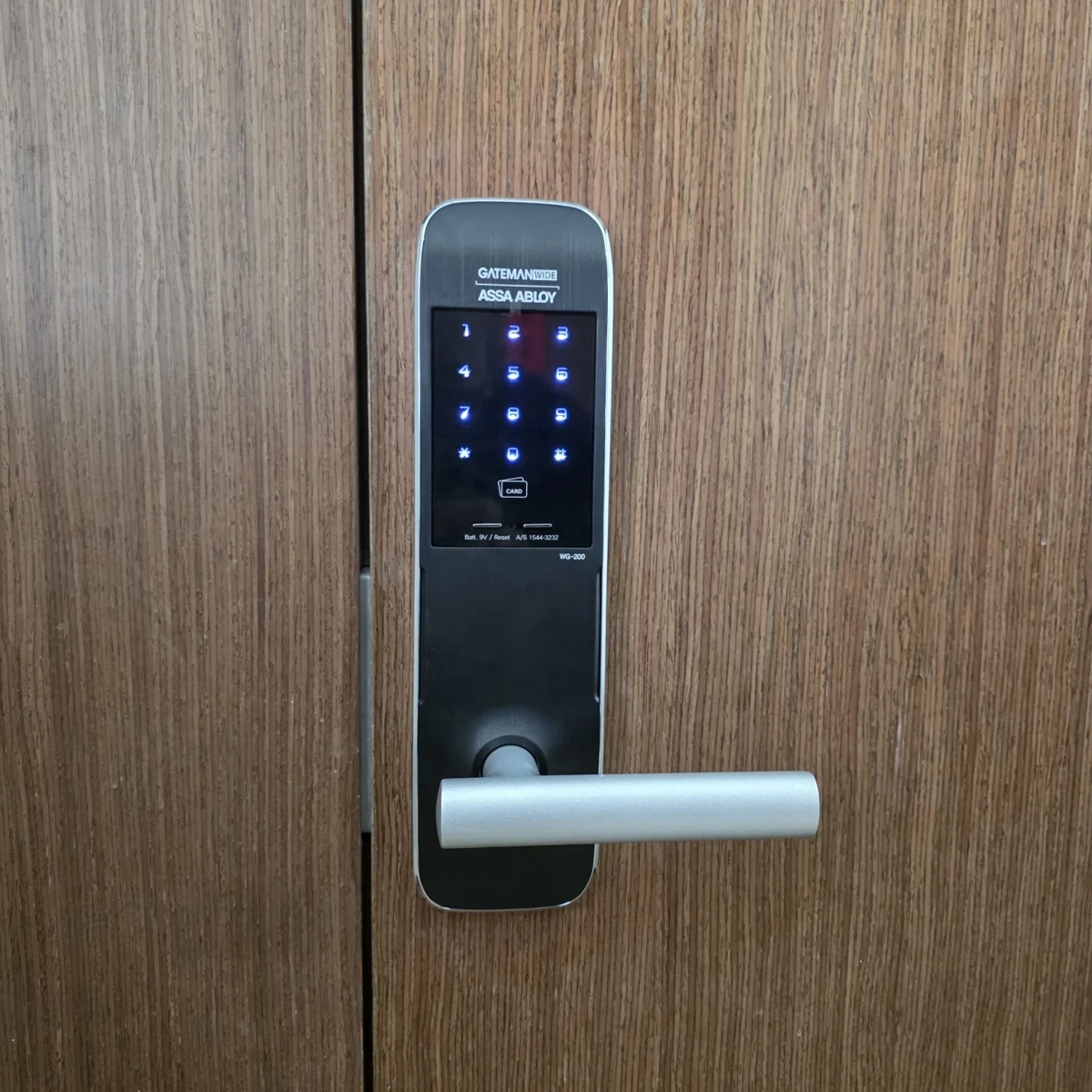Gateman WG200 Digital Lock fitted to a wooden door, with illuminated keypad and silver handle